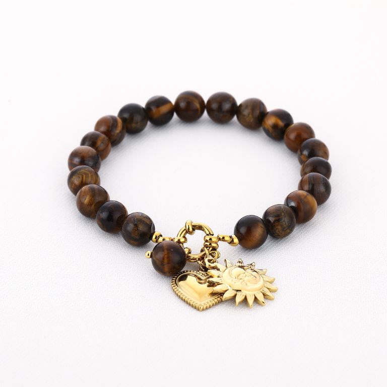Bruine kralenarmband met zon- en hartbedels