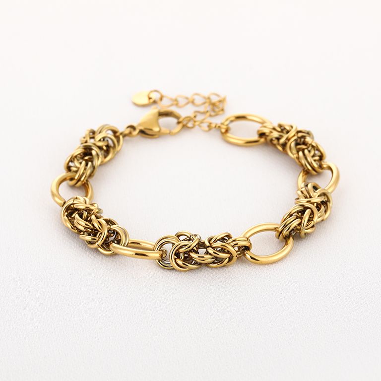 Schakelarmband met knoopdetails – goudkleurig