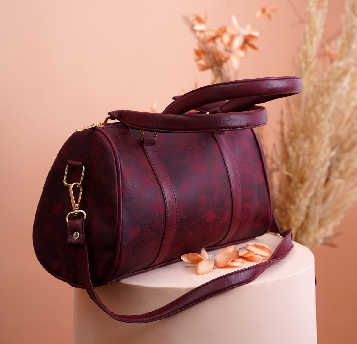 Burgundy handbag with white blouse and silk scarf
